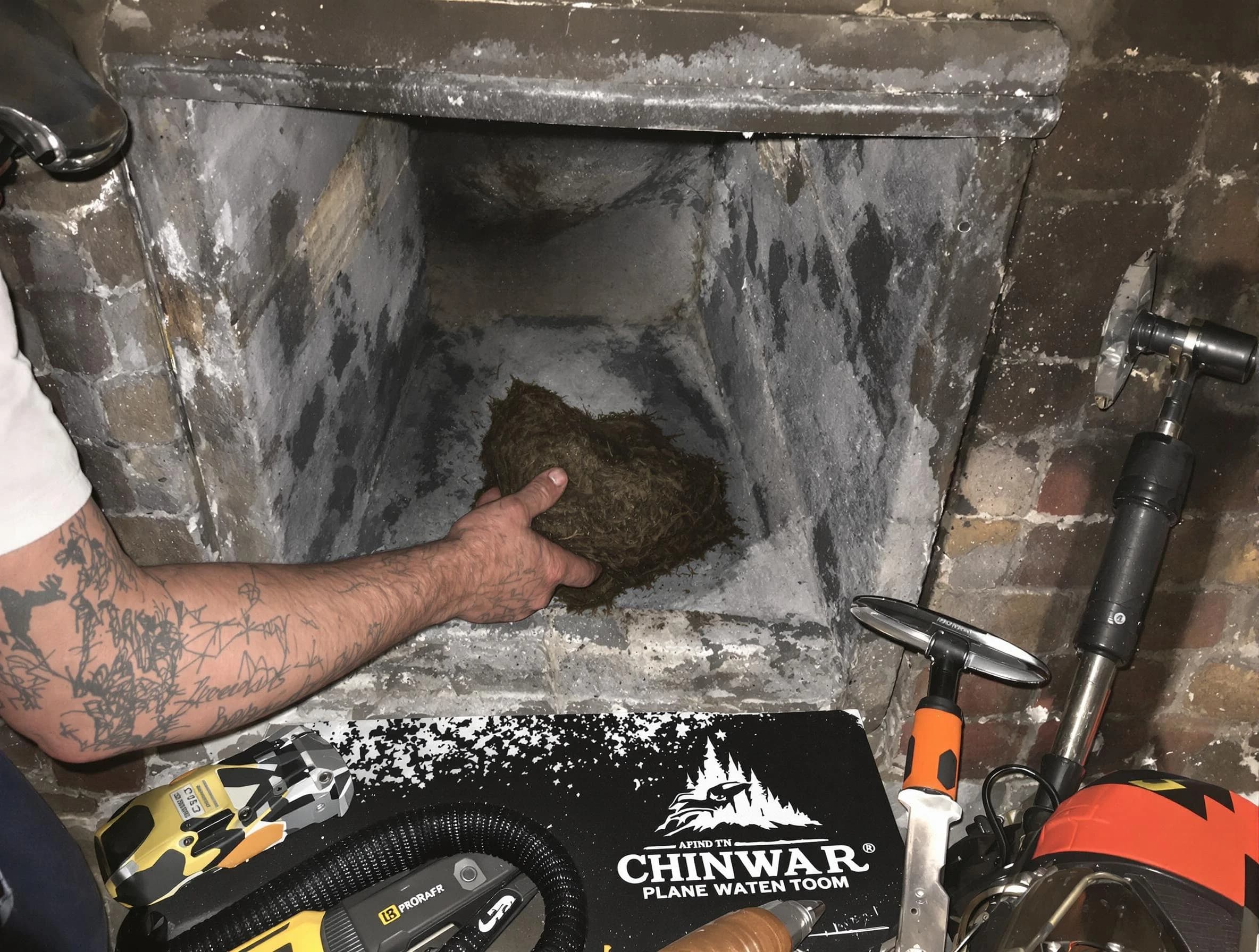 Boulder Chimney Sweep safely removing debris and screening chimney in Boulder, CO